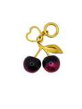 Gold keychain with two purple berries on a white background