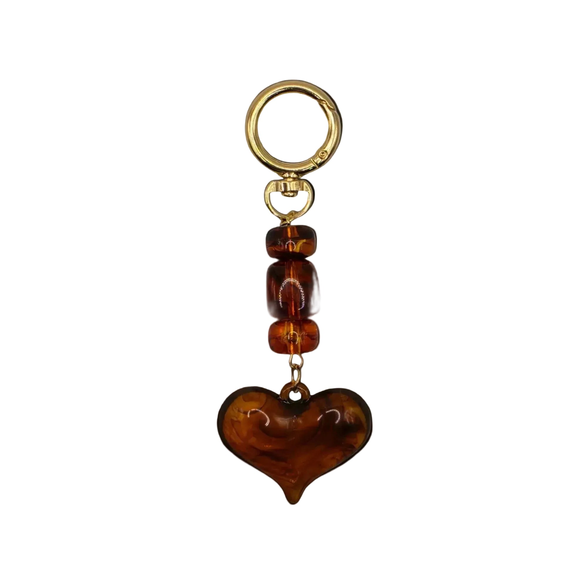 Heart-shaped brown keychain with gold ring on a white background