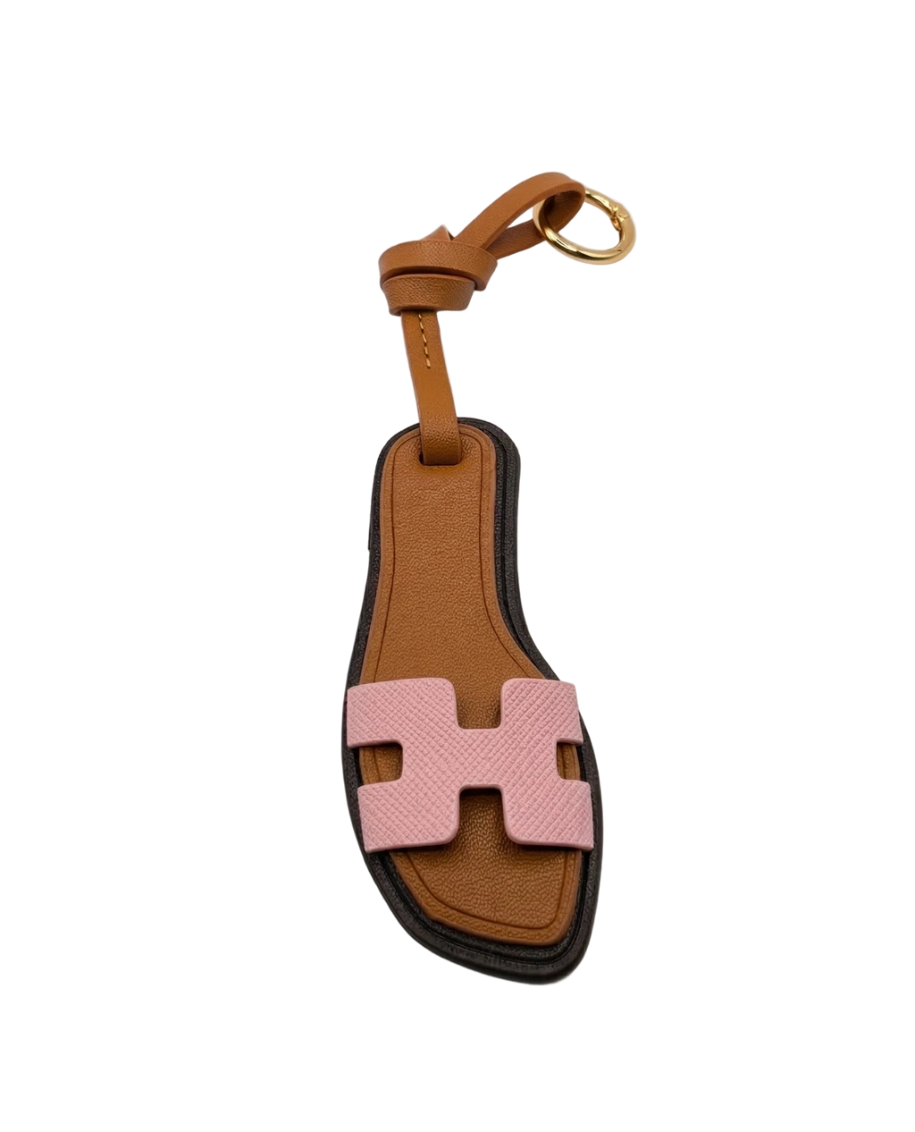 Miniature H-strap leather sandal bag charm in tan textured PVC with gold hardware and decorative loop knot