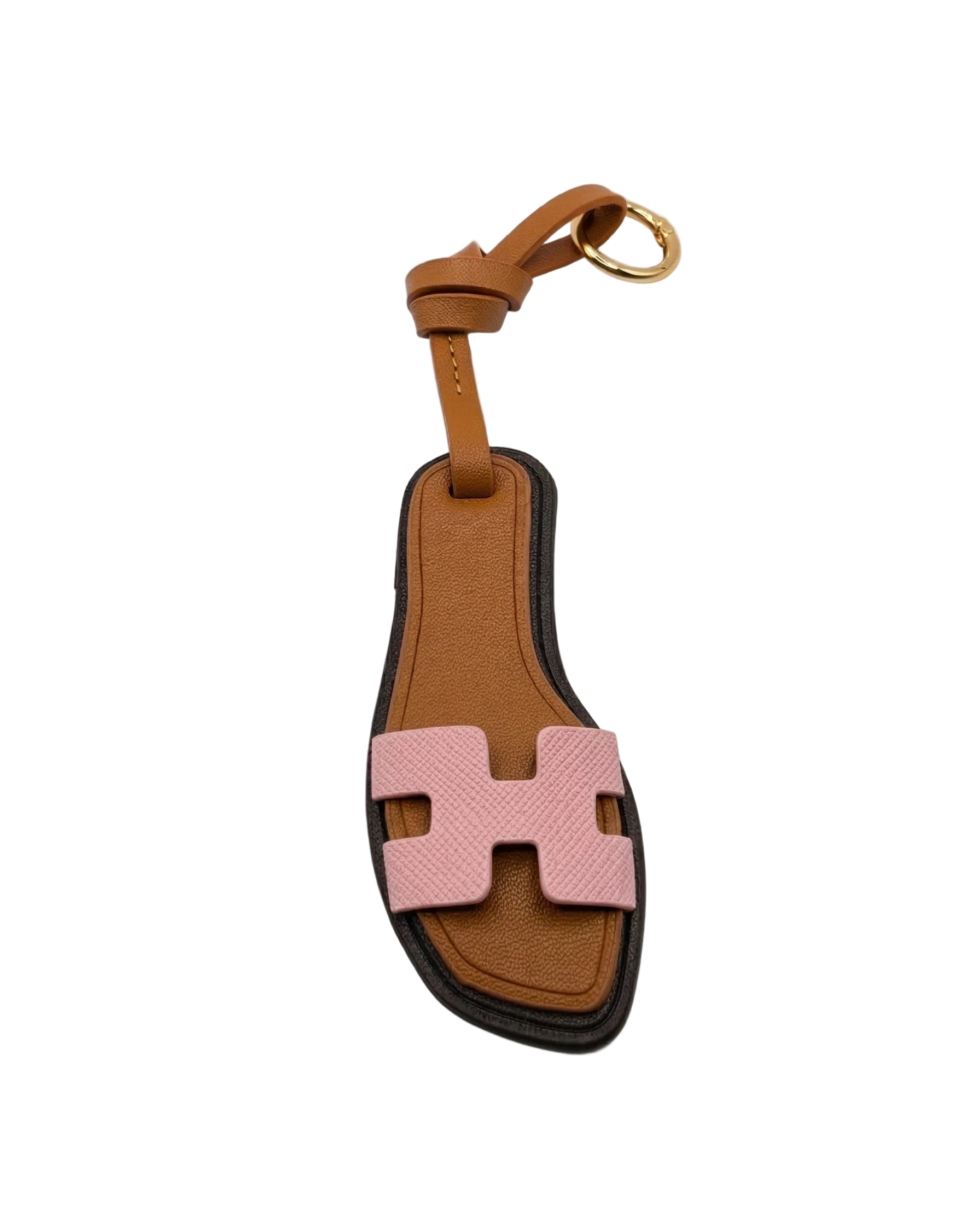 Miniature H-strap leather sandal bag charm in tan textured PVC with gold hardware and decorative loop knot