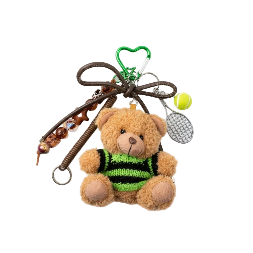 Small teddy bear keychain with decorative elements on a white background