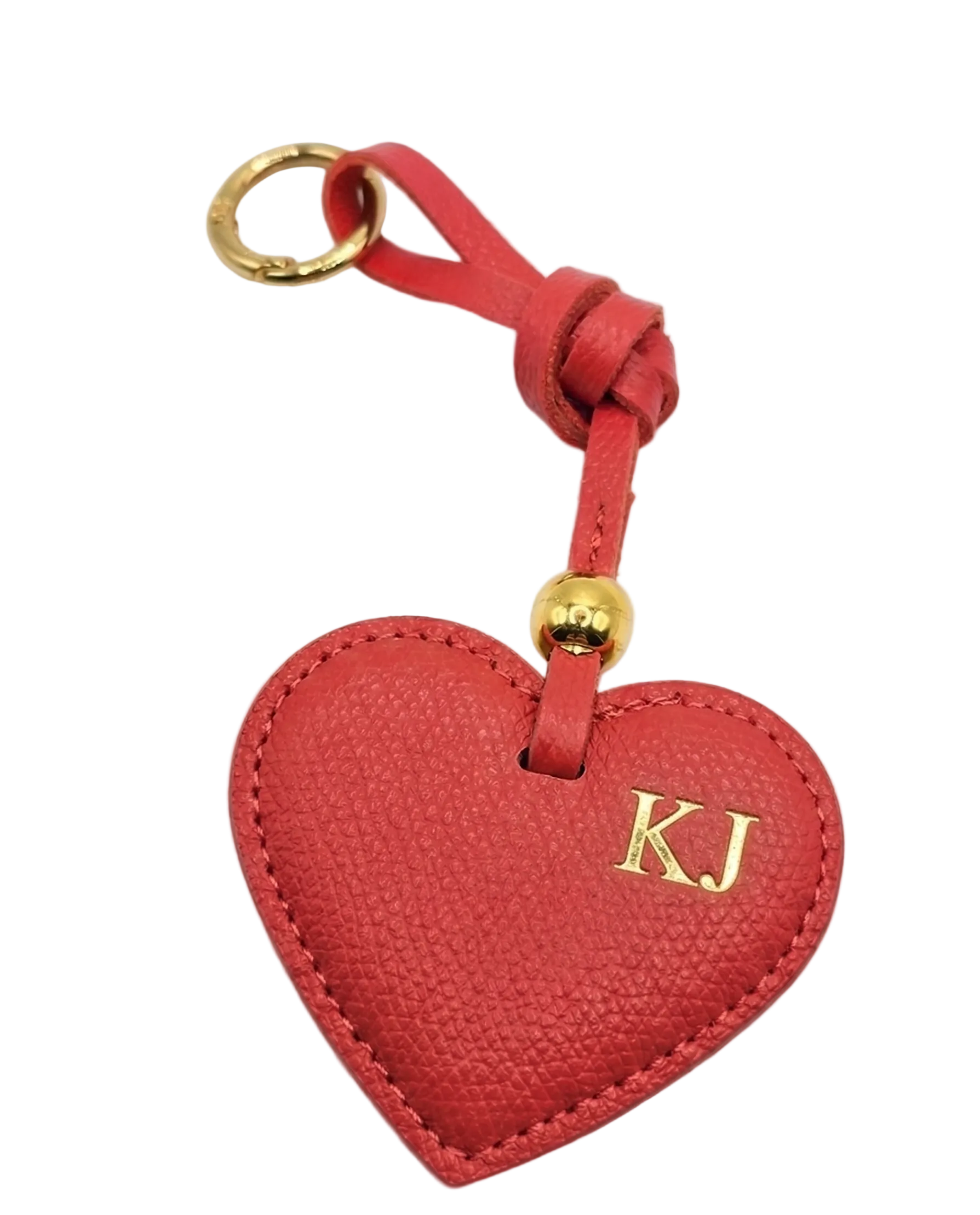 Elegant Grained Leather Heart Bag Charm with padded stitched heart, twisted leather loop, and gold-tone ring