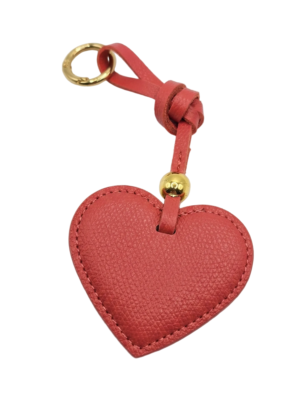 Red heart-shaped keychain with a gold ring on a white background