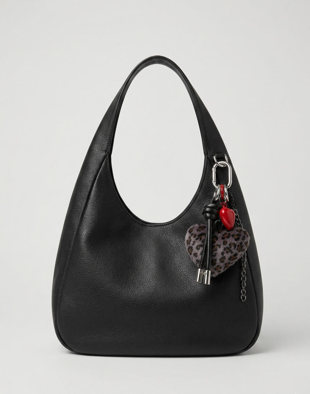 Leopard Heart Bag Charm with fluffy faux fur heart, red heart, black dice, black tassel, and silver carabiner clip