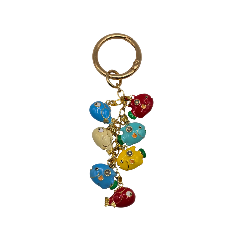 Keychain with colorful fish charms on a beige background