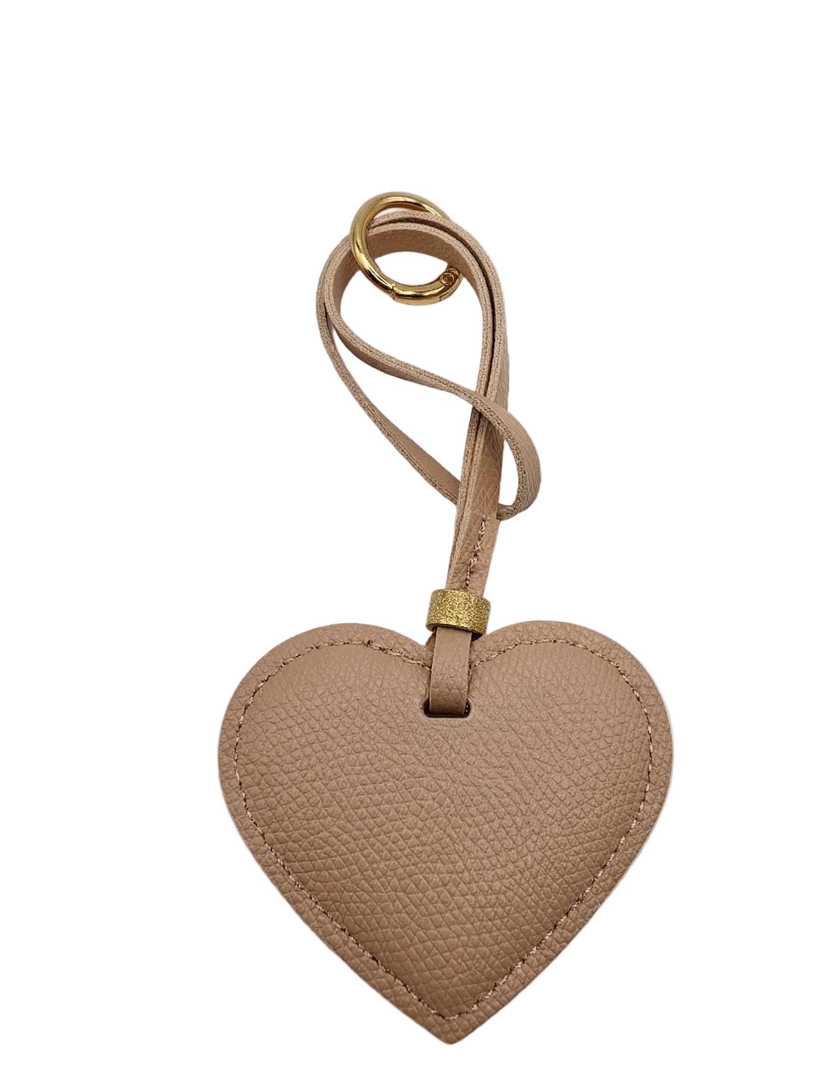 Heart-shaped leather keychain with a strap on a light gray background